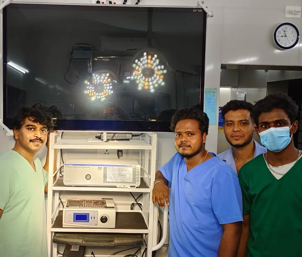 Surgical team at Pratheep Nursing Home beside the 4K laparoscopic camera system and 55-inch surgical monitor